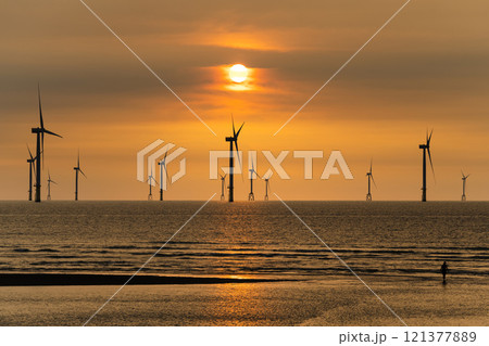 Sunset view of the Offshore wind power systems off the western coast of Taiwan. Sunset view of the Offshore wind power systems off the western coast of Taiwan. 121377889