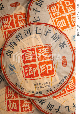 The intricate packaging of traditional Chinese tea cakes adds a unique touch to this art 121378006
