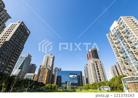 View of the park and surrounding modern buildings in front of Taichung City Council, Taiwan. 121378163