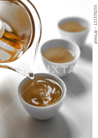 Experience the Elegant Art of Tea Pouring into Cups for a Perfectly Crafted Brew Enjoyment Experience the Elegant Art of Tea Pouring into Cups for a Perfectly Crafted Brew Enjoyment 121378255