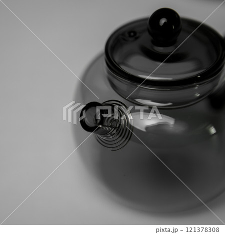 A Stylish and Modern Glass Teapot that Features a Unique and Intriguing Spout Design 121378308