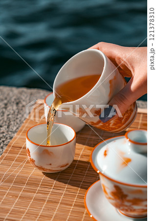 An Elegant Tea Ceremony conducted beautifully by the Water, creating a special moment An Elegant Tea Ceremony conducted beautifully by the Water, creating a special moment 121378310