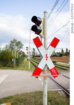 Railway crossing with traffic lights. 121379312