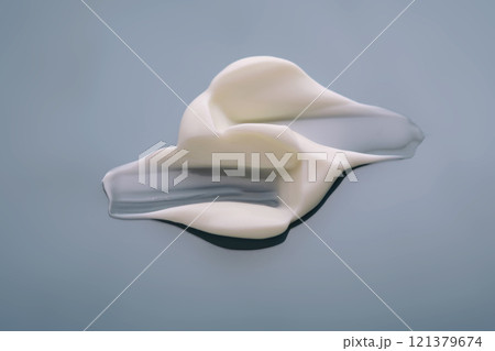 Swatch with white cream texture on a blue background. 121379674