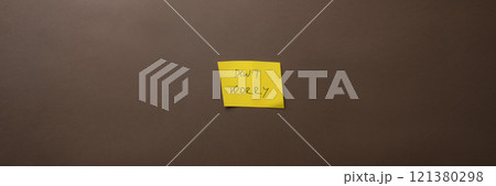 Yellow post it paper with a Dont worry sign on it 121380298