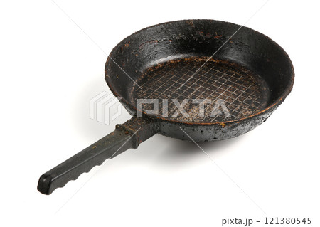 Old metal frying pan for cooking. Dirty dishes empty, food template. 121380545