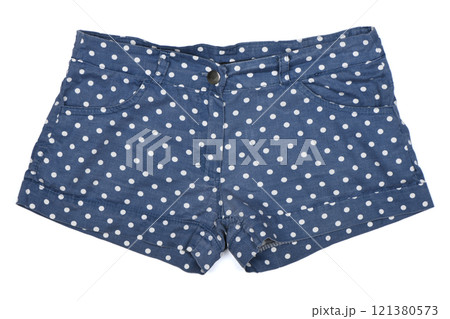 Blue shorts with white polka dots isolated on white background. Blue shorts with white polka dots isolated on white background. 121380573