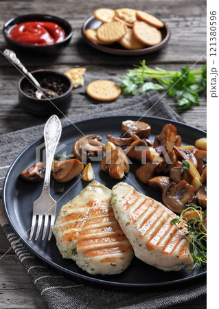 grilled chicken breasts with mushrooms, top view grilled chicken breasts with mushrooms, top view 121380596