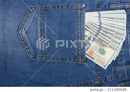 Dollars in jeans pocket. 100 dollar pocket money. Dollars in jeans pocket. 100 dollar pocket money. 121380686