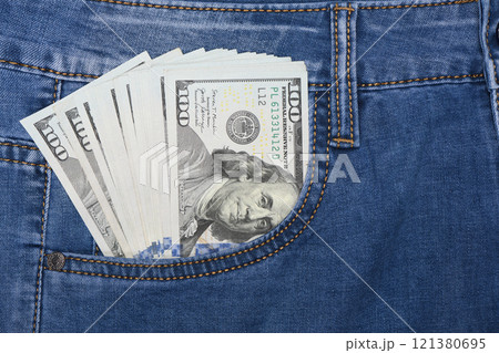 Dollars in jeans pocket. 100 dollar pocket money. Dollars in jeans pocket. 100 dollar pocket money. 121380695