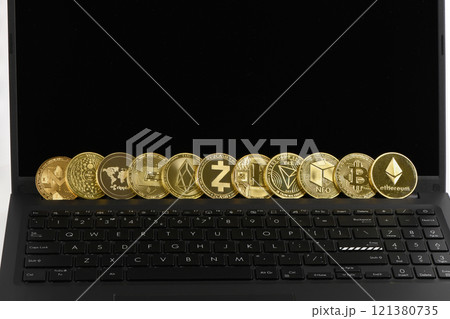 Golden Cryptocurrency on keyboard laptop, Bitcoin , Ethereum, Litecoin, Dashcoin, XRP, EOS, NEO, TRX, Monero, Zcach, Iota and Ripple coins. Golden Cryptocurrency on keyboard laptop, Bitcoin , Ethereum, Litecoin, Dashcoin, XRP, EOS, NEO, TRX, Monero, Zcach, Iota and Ripple coins. 121380735