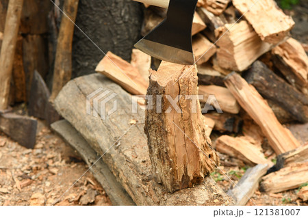Axe and log. High resolution photo. 121381007