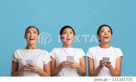 Great Offer. Three Millennial Girls Holding Empty White Board Standing Over Turquoise Studio Background. Mockup 121381735