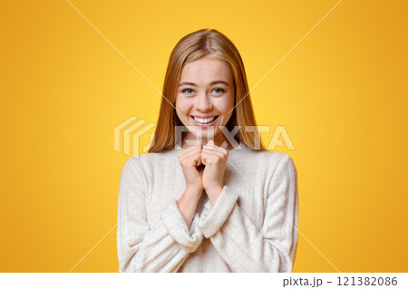 Please, Buy Me These. Excited Girl Pleading For Something And Keeping Hands Together Over Orange Studio Background With Copy Space Please, Buy Me These. Excited Girl Pleading For Something And Keeping Hands Together Over Orange Studio Background With Copy Space 121382086