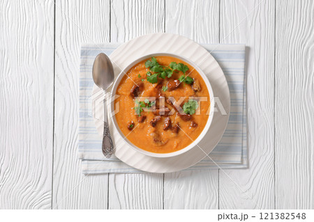 creamy carrot beef soup in a white bowl creamy carrot beef soup in a white bowl 121382548