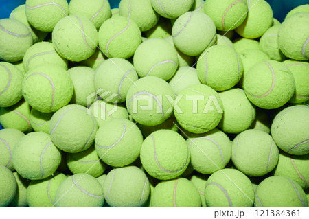 Top view of tennis balls lumped together in pile as tool for gentle wash or effective dry clothing in machine, copy space Top view of tennis balls lumped together in pile as tool for gentle wash or effective dry clothing in machine, copy space 121384361