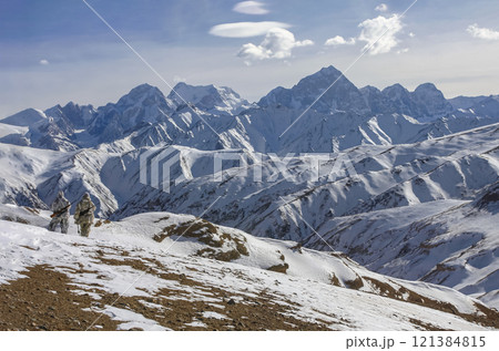 Rangers patrol protected mountain areas with weapons after snowfall. Rangers patrol protected mountain areas with weapons after snowfall. 121384815