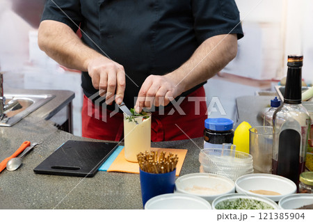 Chef preparing raw sauce in saloon kitchen. 121385904