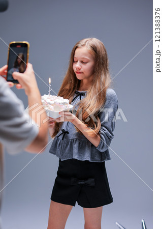 Celebrating a Special Birthday with a Beautiful Cake and Bright Candles for the Occasion Celebrating a Special Birthday with a Beautiful Cake and Bright Candles for the Occasion 121388376