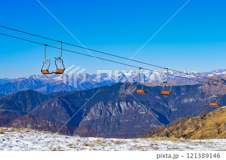 ski lift, landscape with mountains and snow, a ski resort in the mountains ski lift, landscape with mountains and snow, a ski resort in the mountains 121389146