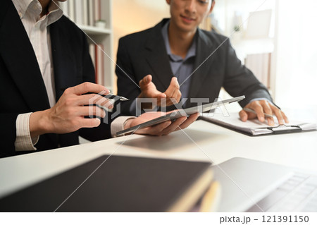 Cropped shot business advisor explaining the contract offering it for the client to sign. Cropped shot business advisor explaining the contract offering it for the client to sign. 121391150