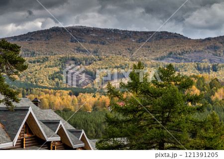 Mountains, forest and village on a cloudy autumn day 121391205