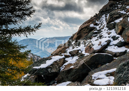 Rock, mountains and autumn forest in cloudy weather Rock, mountains and autumn forest in cloudy weather 121391218
