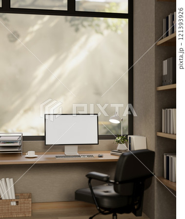 A comfortable, minimalist office featuring a computer with a white screen mockup on a wooden desk. A comfortable, minimalist office featuring a computer with a white screen mockup on a wooden desk. 121393926