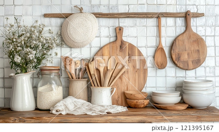 Rustic kitchen decor with wooden utensils and natural textures for cozy ambiance 121395167
