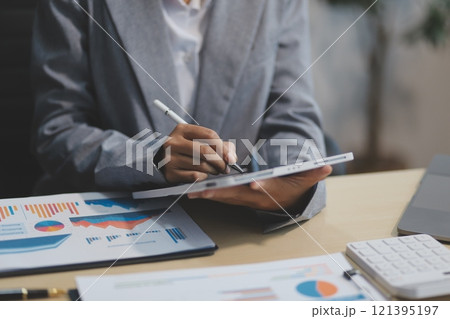 Business Documents, Auditor businesswoman checking searching document legal prepare paperwork or report for analysis TAX time,accountant Documents data contract partner deal in workplace office 121395197