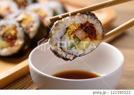 Gimbap or kimbap, Korean food made from cooked rice with vegetables wrapped with dried seaweed 121395522