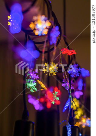 Colorful Snowflake LED Lights Creating a Festive Glow at Night. High quality photo 121395977