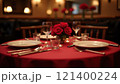 Elegant table setting with red roses for a romantic dinner 121400224