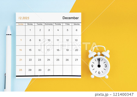 December 2025 Monthly calendar for 2025 year with pen on yellow and blue background. December 2025 Monthly calendar for 2025 year with pen on yellow and blue background. 121400347