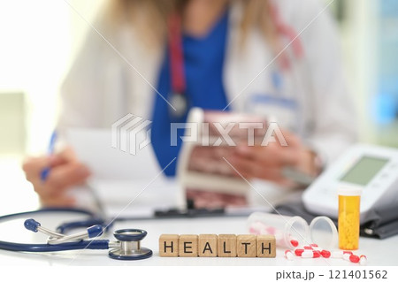 Healthcare professional diligently reviewing and analyzing essential patient health information 121401562