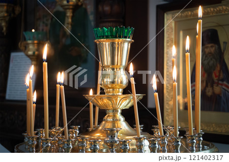 Burning Candles in a Lampada in an Orthodox Church Burning Candles in a Lampada in an Orthodox Church 121402317