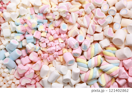 Confectionery and sweeties varieties background: light pink and white marshmallows, sugar confetti, bonbon and candies 121402862