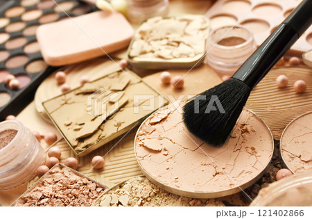 Brush with beauty cosmetics background, varieties of face powders and foundations for perfect complexion, basic make up products to even out and matte skin, selective focus, shallow DOF Brush with beauty cosmetics background, varieties of face powders and foundations for perfect complexion, basic make up products to even out and matte skin, selective focus, shallow DOF 121402866