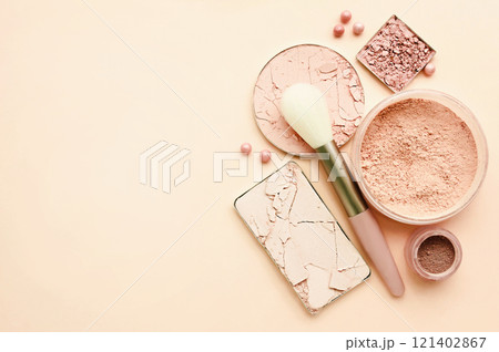 Varieties of face powders and foundations for perfect complexion, basic make up products to even out and matte skin, beauty cosmetics with brushes and sponges, selective focus Varieties of face powders and foundations for perfect complexion, basic make up products to even out and matte skin, beauty cosmetics with brushes and sponges, selective focus 121402867