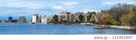 Landscape view over the city, artificial lake and park of Tirana, Albania 121402897