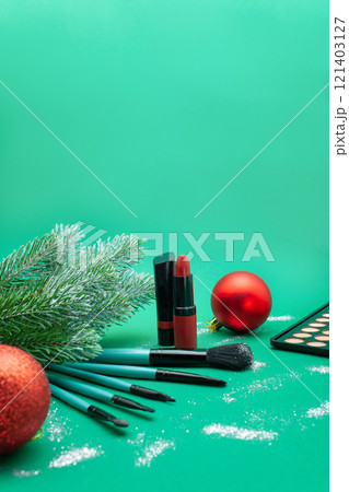 Christmas, New Year's background for make-up artist. brushes, Christmas decorations, spruce. Empty space for text. Christmas, New Year's background for make-up artist. brushes, Christmas decorations, spruce. Empty space for text. 121403127