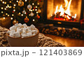Cup of hot chocolate with marshmallows by the fireplace and christmas tree lights 121403869