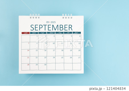 September 2025 Monthly desk calendar for 2025 year on blue color background. 121404834