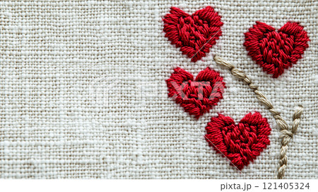 Handmade red hearts on white canvas background for valentine's day decorations or embroidery art projects 121405324