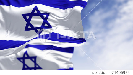 State of Israel national flags waving in the wind on a clear day 121406975