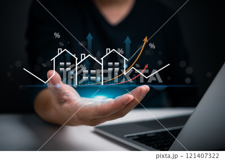 Businessman holding virtual graph showing real estate market growth. Perfect for financial, real estate, and investment presentations. Property market analysis concept. 121407322