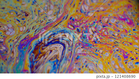 Paint blend. Spot gasoline. Defocused multicolor purple green liquid oil curve acrylic slick on dark black blurred light abstract art background. 121408690