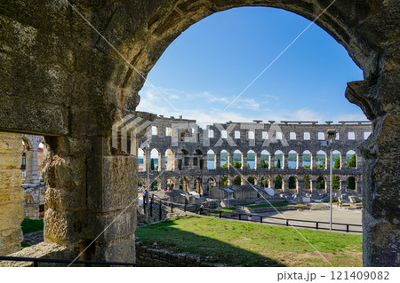 Facade of the ancient ruins of one of the largest preserved Roman amphitheaters in Pula, Istria 121409082