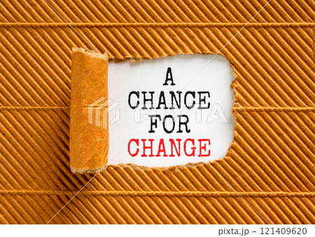 A chance for change symbol. Concept words A chance for change on beautiful white paper. Beautiful brown background. Business A chance for change concept. Copy space. A chance for change symbol. Concept words A chance for change on beautiful white paper. Beautiful brown background. Business A chance for change concept. Copy space. 121409620