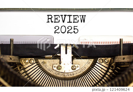 Planning review 2025 new year symbol. Concept words Review 2025 typed on beautiful old retro vintage typewriter. Beautiful white paper background. Business review 2025 new year concept. Copy space. 121409624